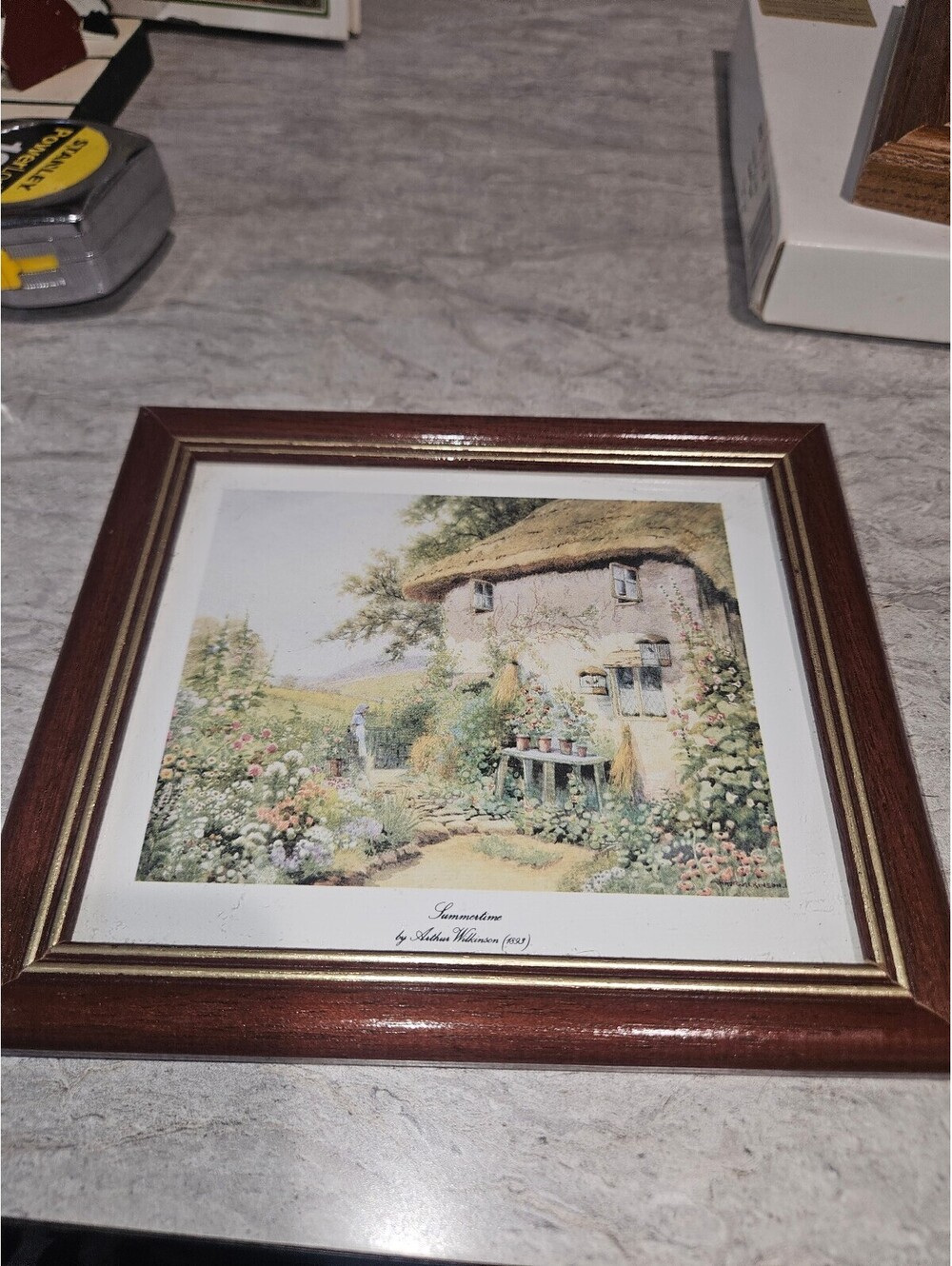 Framed Print of Quaint Cottage Garden by John Haskins (1981)